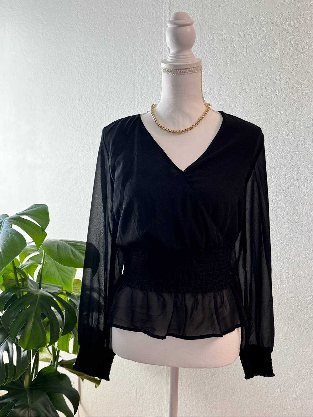 Black Long-Sleeve V-Neck Smocked Peplum Top - Brand: